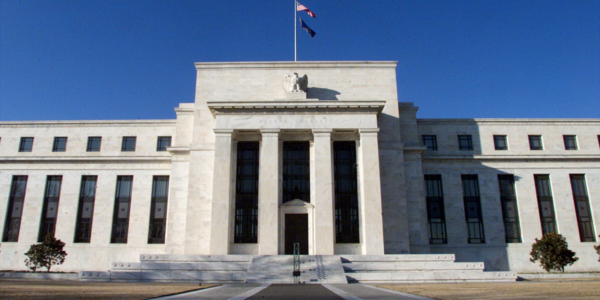 Economy Shrinks as Imports Surge, Fed Holds Rates Steady
